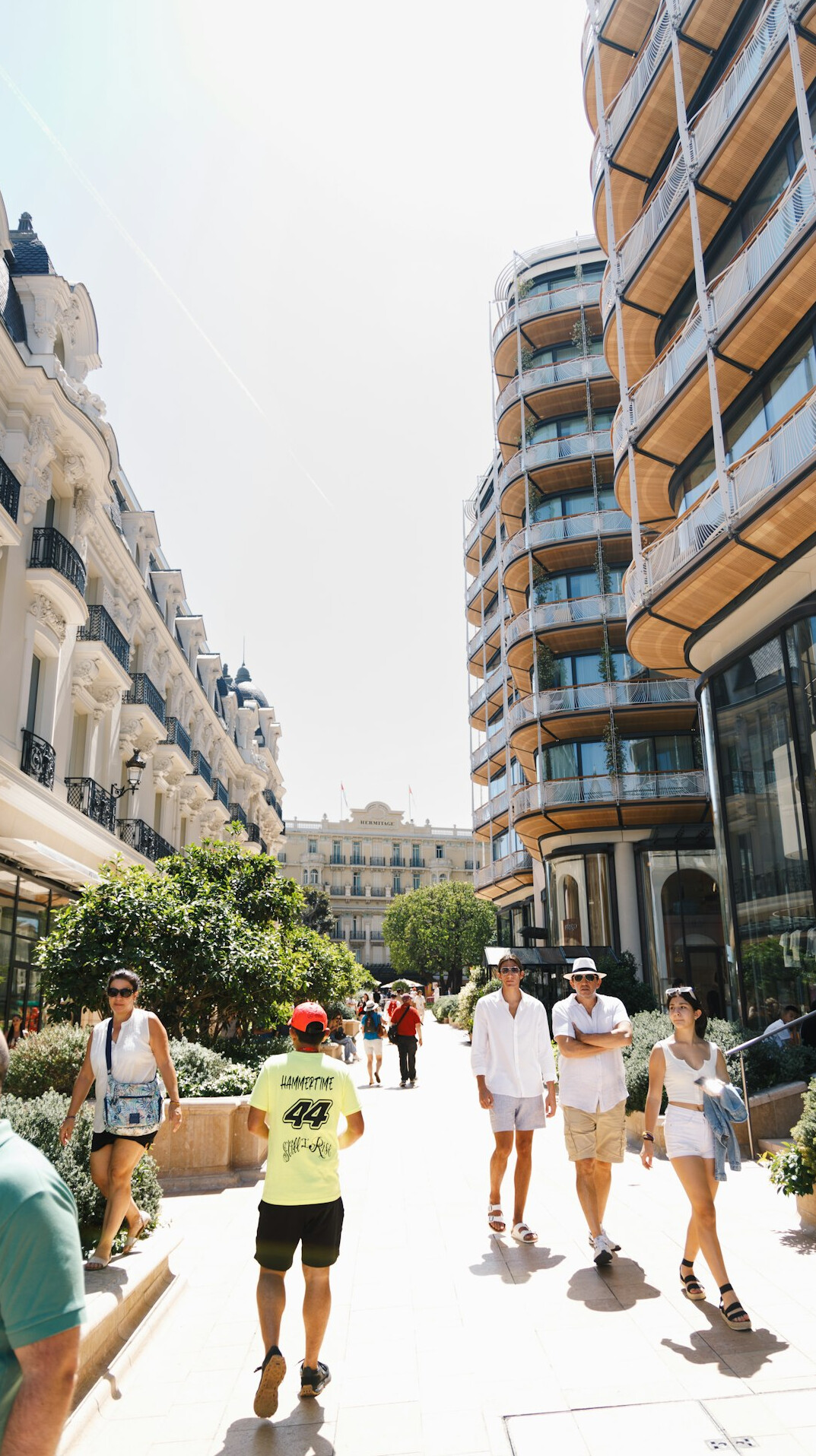 People crossing an open public plaza in the city centre