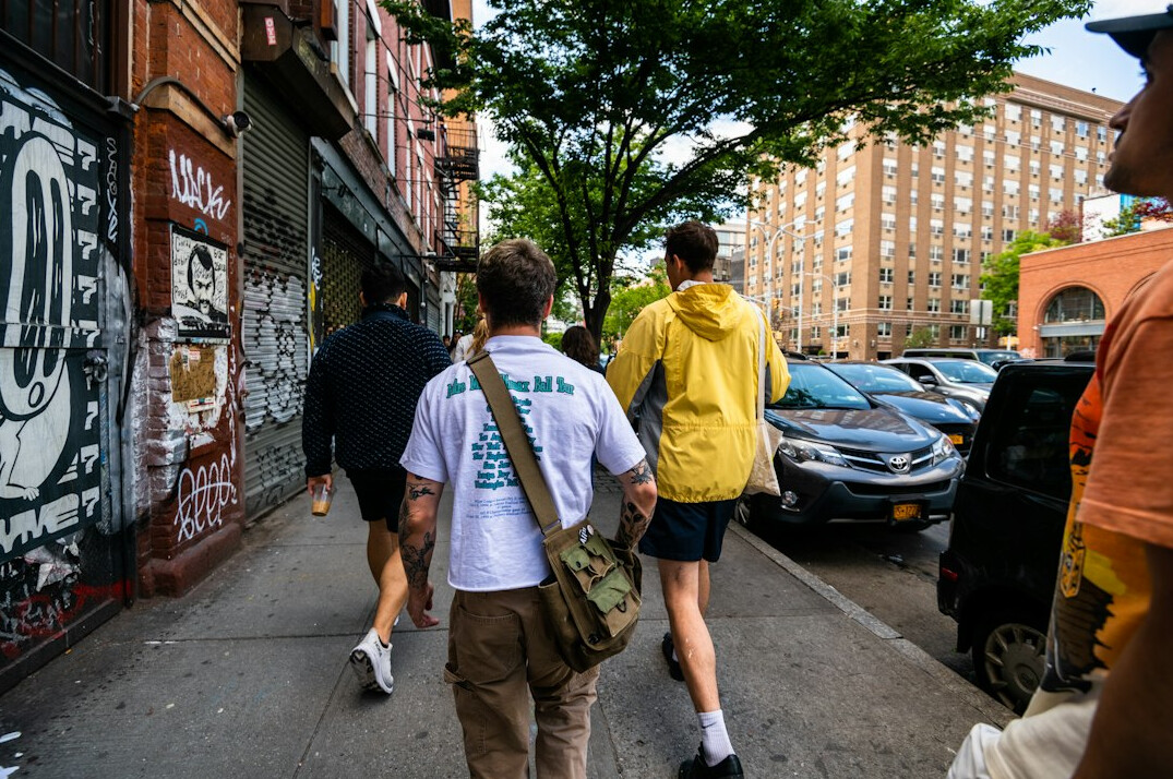group walking together on sidewalk
