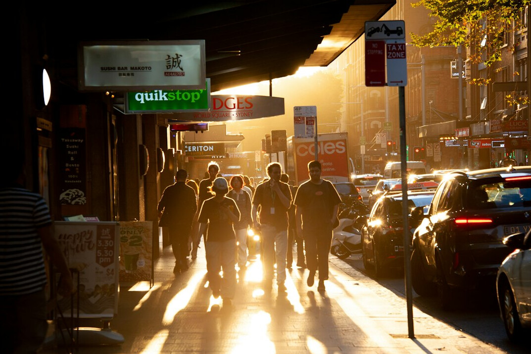 people walking on busy sidewalk