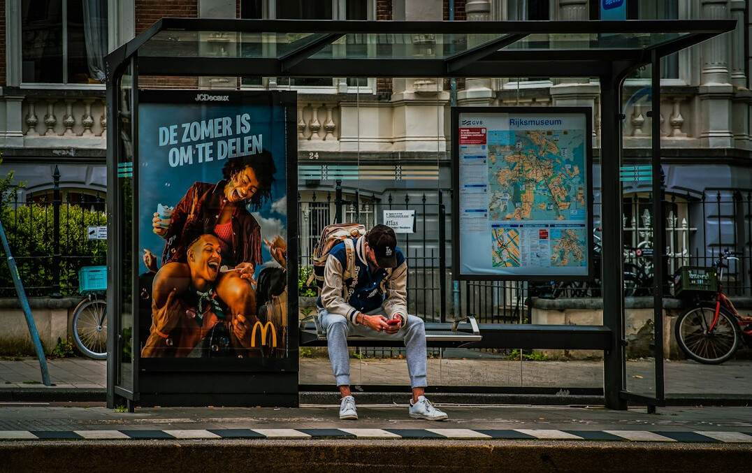 person waiting at bus stop