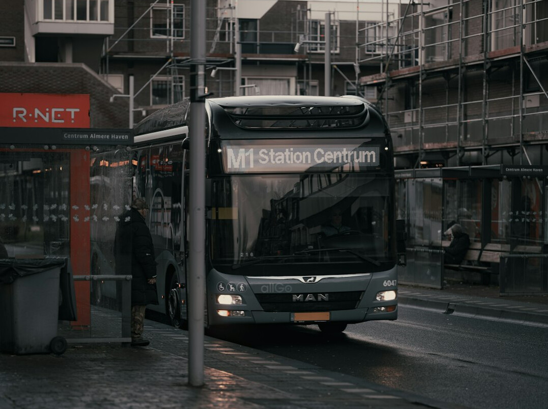 person waiting at bus stop